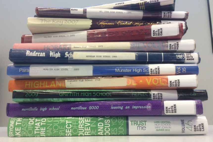 Stack of school yearbooks