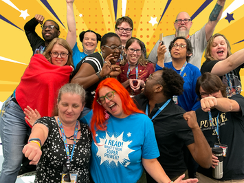 A group of enthusiastic librarians striking superhero posts