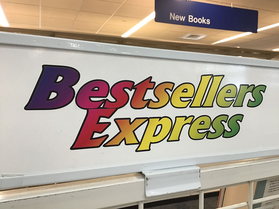 A sign showing the words bestsellers express in rainbow gradient