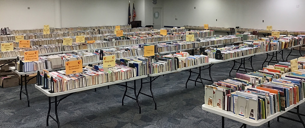 Rows of tables in a huge room at the annual friends book sale