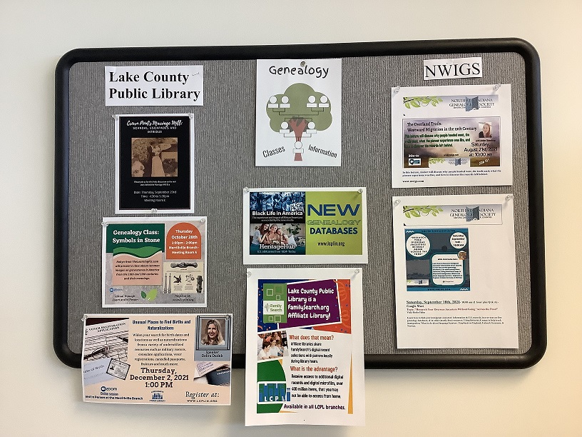 A bulletin board with flyers for genealogy tools and events
