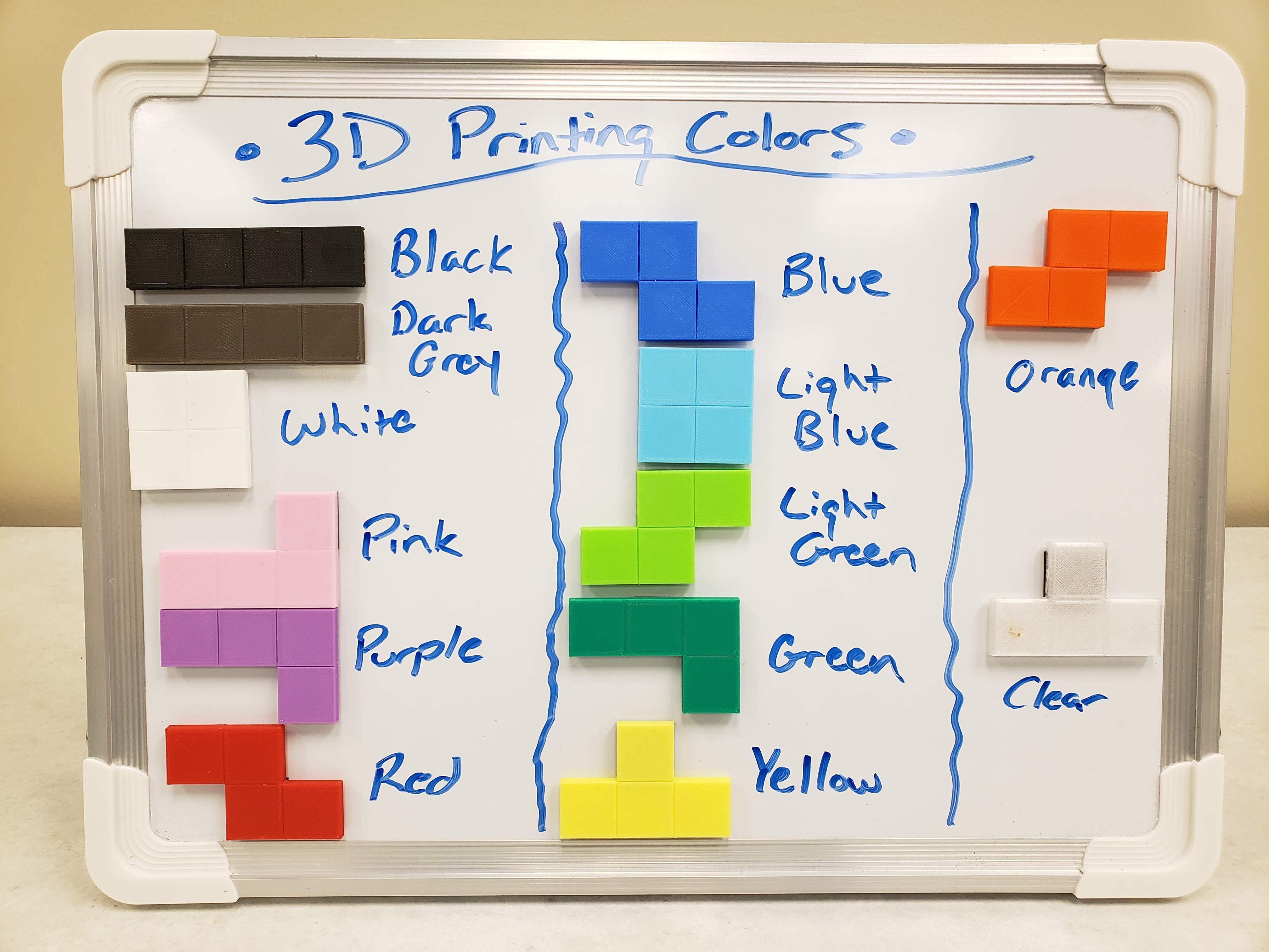 3D printed Tetris pieces showing the different colors and qualities of filament